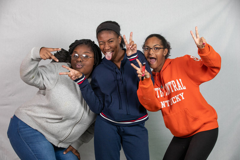 Three teenage girls goofing around at the Boys and Girls Club of Bowling Green